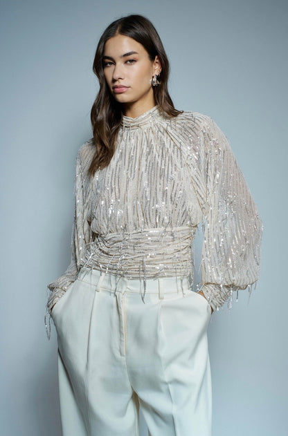 BLUSA CON LENTEJEELAS