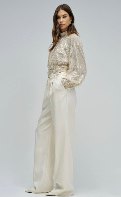 BLUSA CON LENTEJEELAS