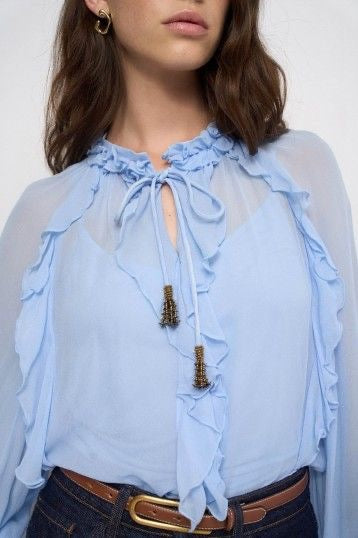 BLUSA CON VOLANTES AZUL